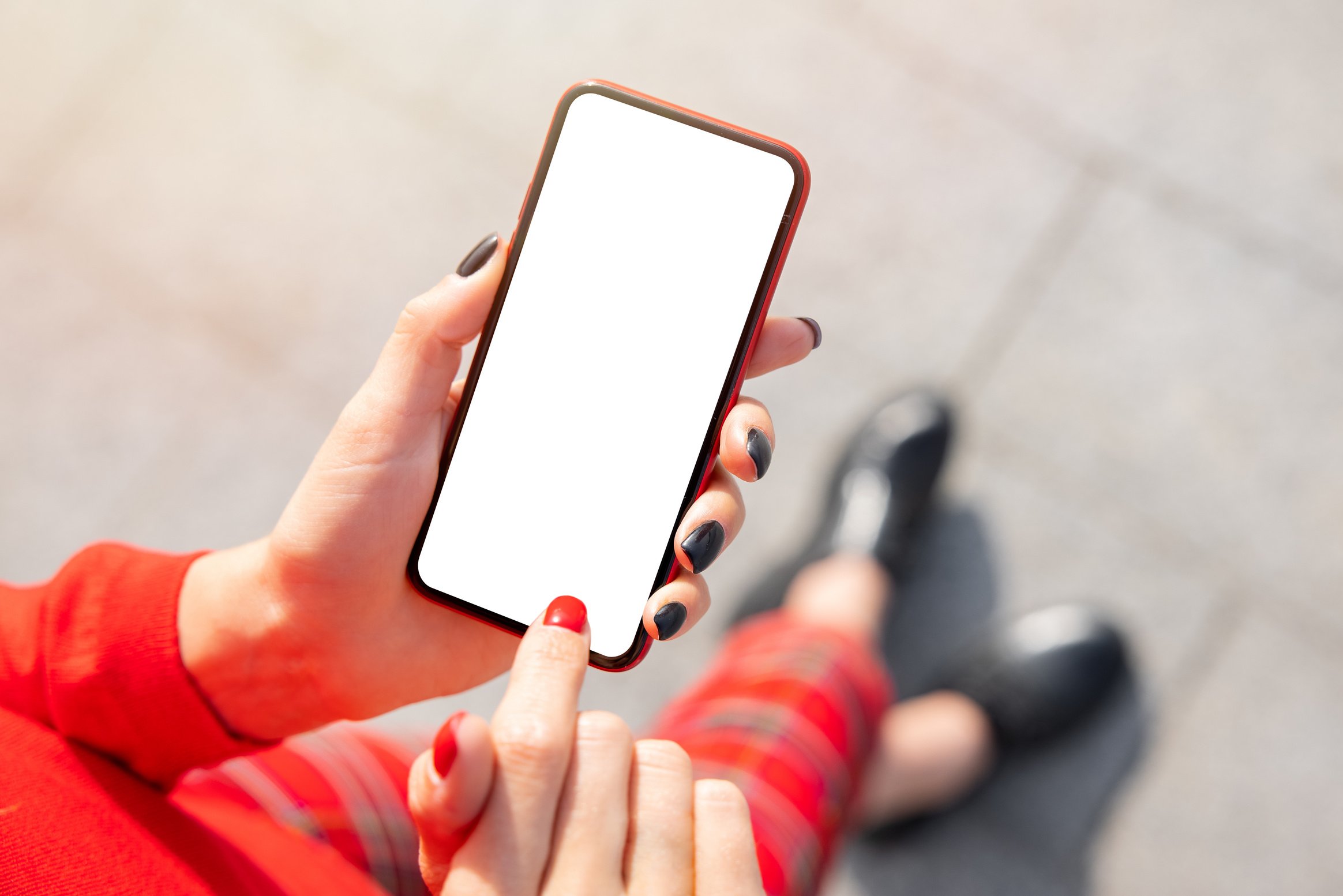 Close-up of Woman Hand's Using Mobile Phone with Blank Screen